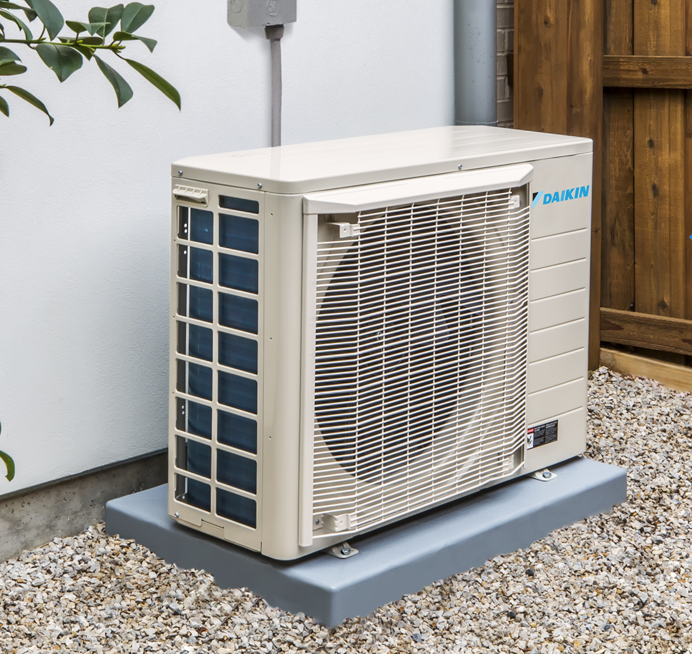 Chillmasters engineer installing an air-to-air heat pump
